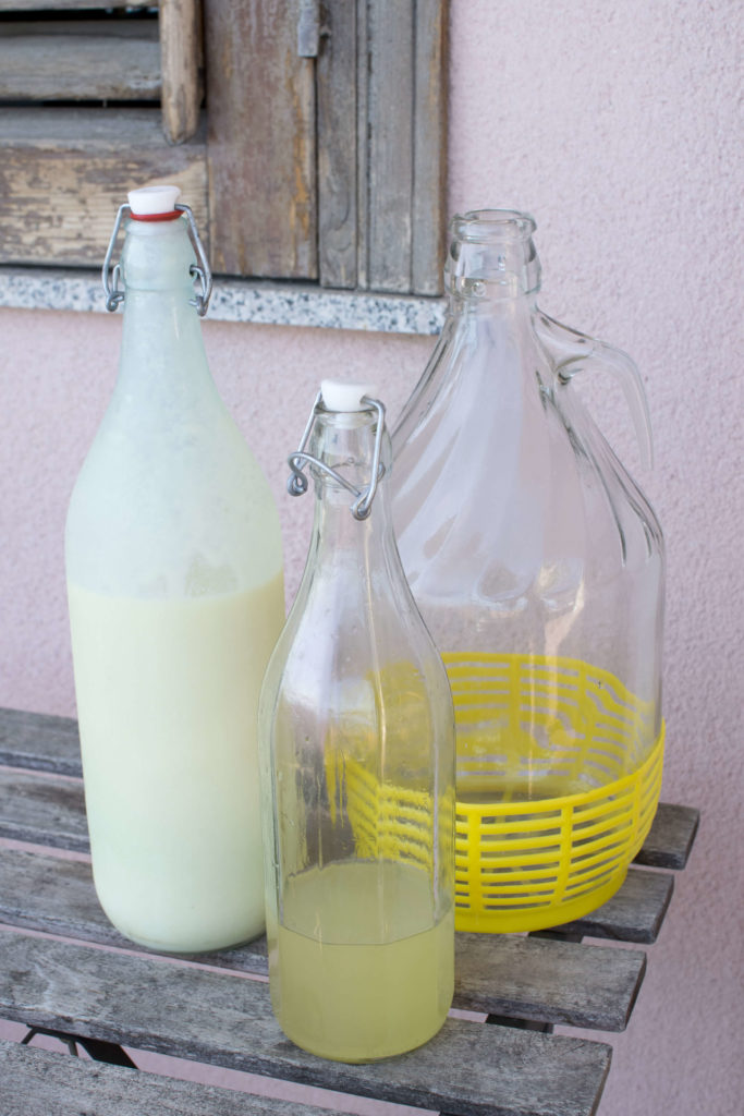 Creamy Limoncello on the left, Original Limoncello in the middle, and the big jug on the right.